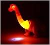 Динозавр с проектором света несет яйца 6662A